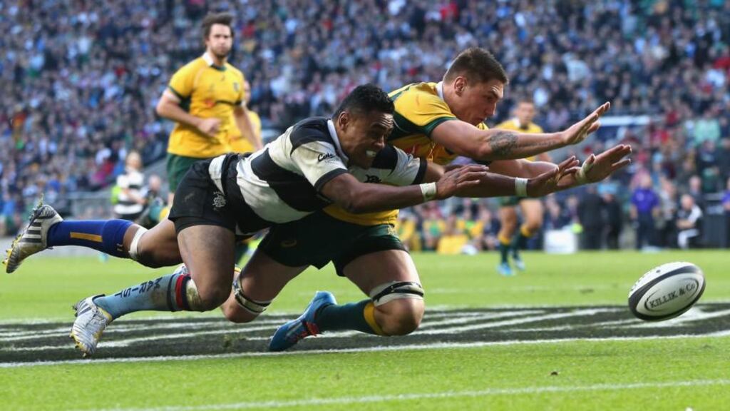 Francis Saili of the Barbarians beats Sean McMahon to the ball to score a try  at Twickenham. Photograph:  David Rogers/Getty Images