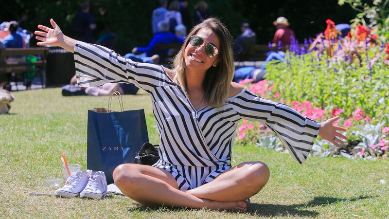 Mayara Agappes, orignally from Sao Paulo, Brazil, but now living in Kilmainham enjoying the good weather in Stephen’s Green in Dublin. Photograph: Gareth Chaney Collins
