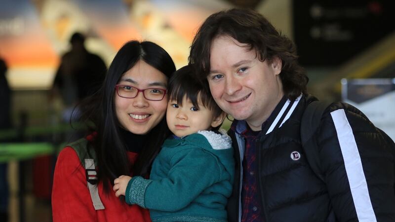 Ting Ting Lin, son Conn (2) and Brian Farrelly from Co Meath. Photograph: Nick Bradshaw