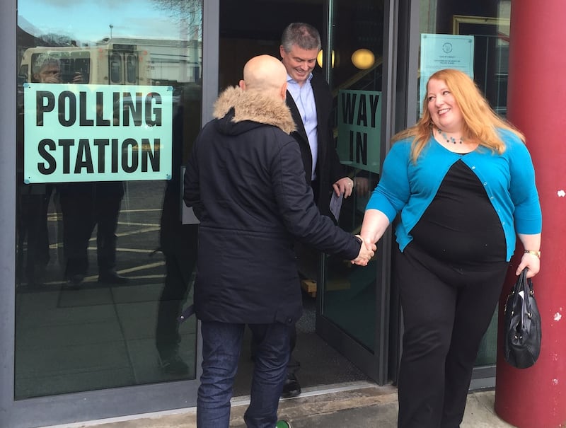 Alliance leader Naomi Long followed by her husband Michael (back) after casting her vote at Saint Colmcille's parochial hall in Belfast. Photograph: David Young/PA