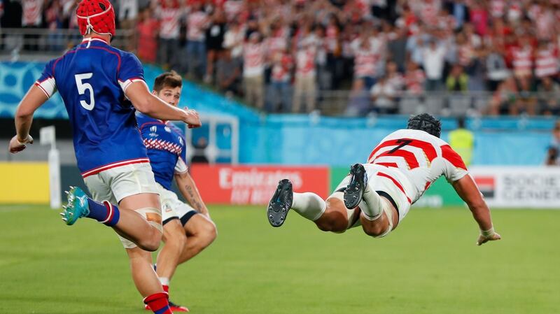 Pieter Labuschagne dives to score for Japan. Photograph: Odd Andersen/AFP/Getty