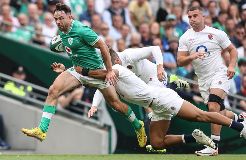 Ireland's Hugo Keenan is tackled by England's Joe Marchant and Elliot Daly at the Aviva Stadium. Photograph: Ben Brady/Inpho