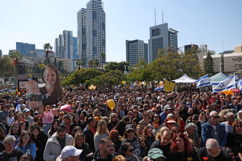 Crowds gather at Hostages Square in Tel Aviv on Wednesday to pay their respects to Shiri Bibas and her two sons, whose bodies were returned to Israel as part of the ceasefire agreement. Photograph: Ahmad Gharabli/AFP via Getty Images