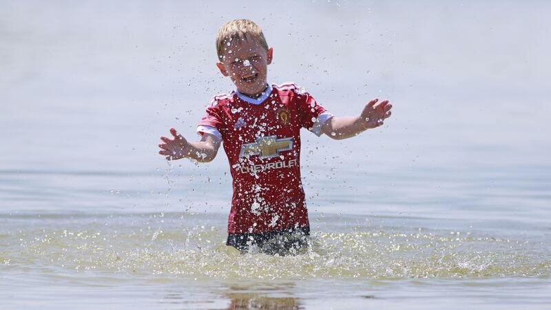 Ciaran Berry (7) from Mullingar cooling off in Lough Ennell. Photograph: Nick Bradshaw/The Irish Times.