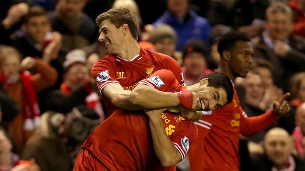 Liverpool’s Steven Gerrard (left) celebrates with team-mate Luis Suarez after scoring his side’s first goal at Anfield. Photograph: Peter Byrne/PA Wire