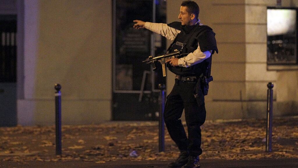Police survey the area of Boulevard Baumarchais after attacks in Paris, France. Photograph: Thierry Chesnot/Getty Images
