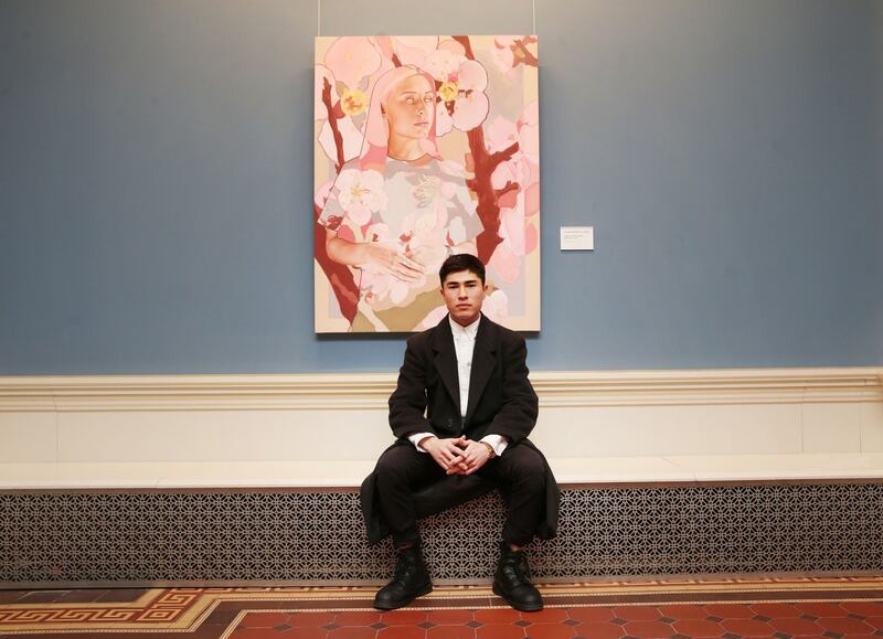 Shane Berkery beside his portrait Lady and the Cherry Blossoms at the National Gallery of Ireland as part of the Hennessy Portrait Prize. Photograph: Leon Farrell/Photocall Ireland.