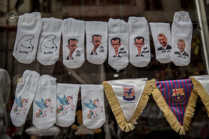 Socks making fun of Syrian president Bashar al-Assad for sale in central Homs. Photograph: Sally Hayden