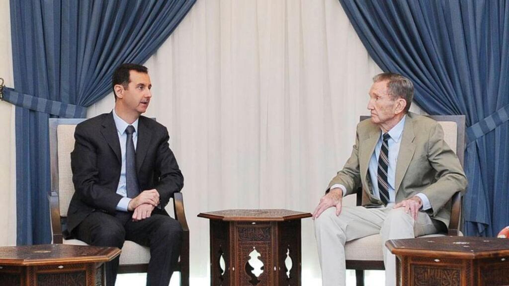 Syria’s president Bashar al-Assad (left) meets with former US attorney general Ramsey Clark in Damascus in this handout photograph distributed by Syria’s national news agency SANA. Photograph: Reuters