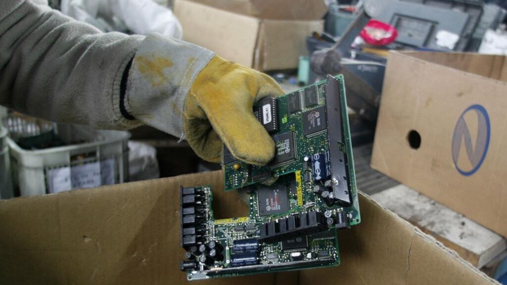 An obsolete printed circuit board being sorted at a recycling plant. Photograph: Enrique Marcarian/Reuters