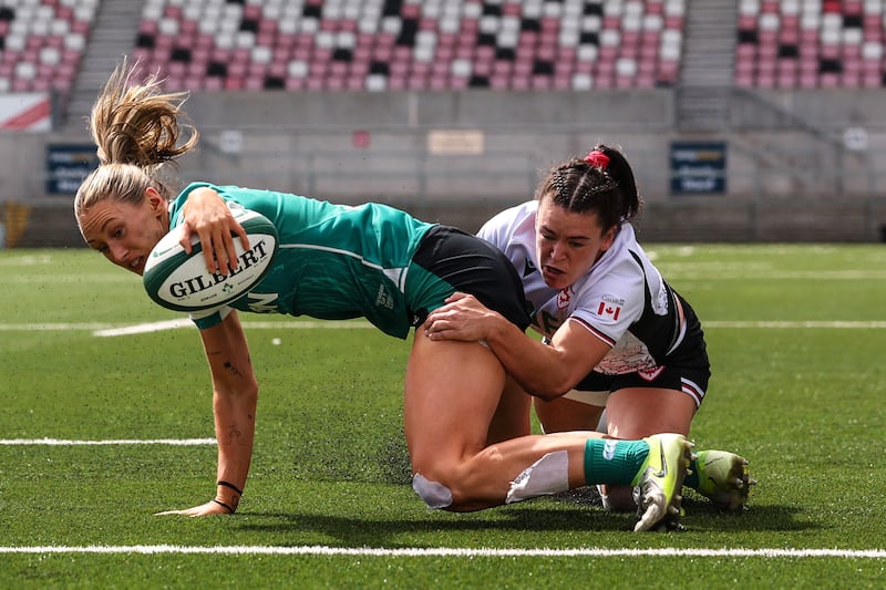 Ireland's Anna McGann scores her side's second try in Belfast despite McKinley Hunt of Canada. Photograph: INPHO/ Ben Brady