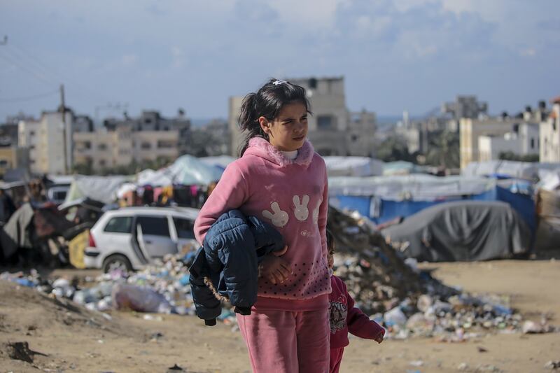 A Palestinian girl, who fled with her family from the northern Gaza Strip, walks near their shelter in Deir Al Balah, Gaza Strip on February 1st. Photograph: Mohammed Saber/EPA-EFE