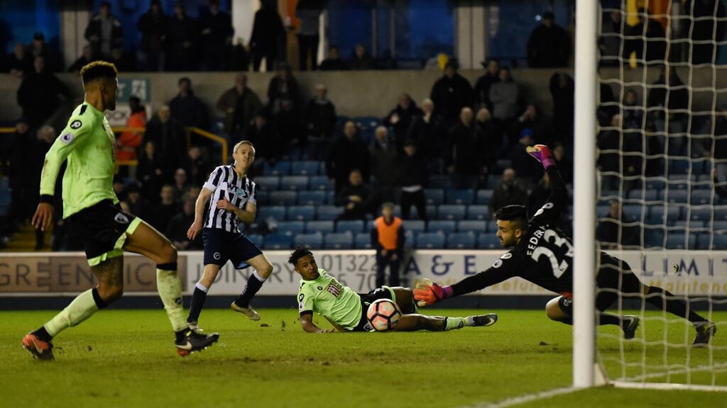 Millwall’s Shane Ferguson scores their third goal in the FA Cup third round win over Bournemouth. Photo: Tony O’Brien/Reuters
