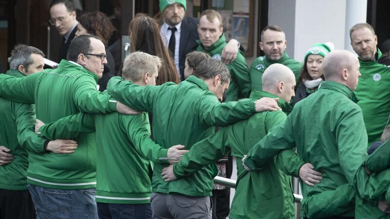 Members of Rathcoole Boys Soccer Club form a guard of honour at the funeral of Conor (9), Darragh (7) and Carla (3) McGinley. Photograph: Colin Keegan/Collins Dublin