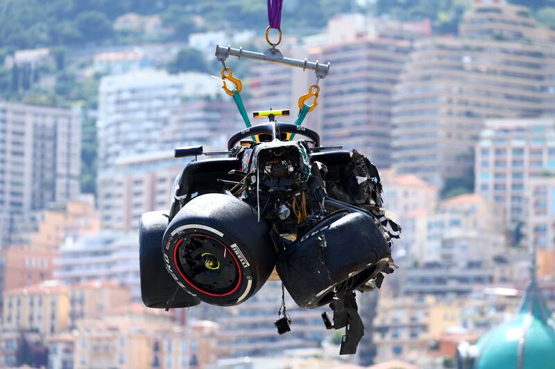 The Red Bull of Sergio Pérez is recovered from the track after crashing during the Monaco Grand Prix. Photograph: Clive Rose/Getty Images
