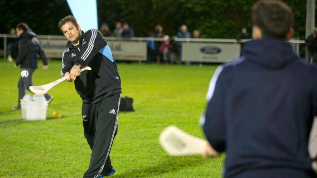 All Blacks captain Richie McCaw tries his hand at hurling with Dublin’s Bernard Brogan during the AIG-hosted Dublin GAA and New Zealand All Blacks’ Unique Skills Challenge at Westmanstown Sports and Conference Centre in Clonsilla, Co Dublin. Photograph: Morgan Treacy/Inpho