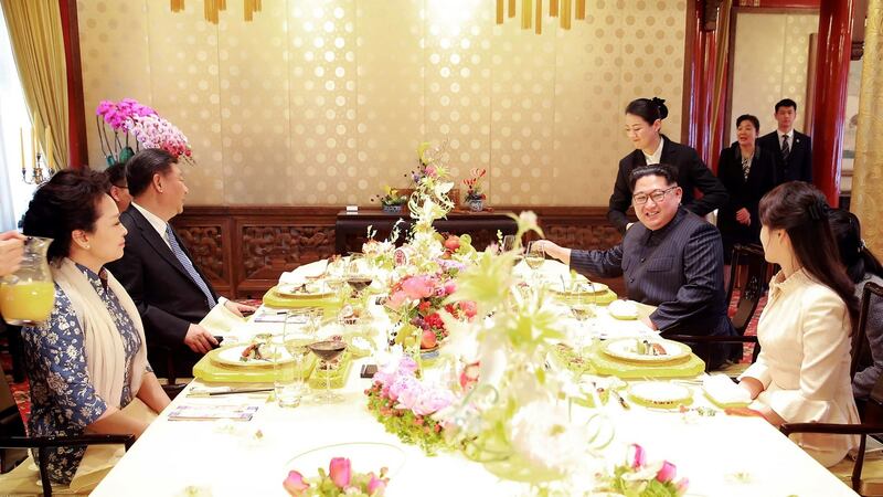 Chinese president Xi Jinping and his wife sit down for lunch with North Korean leader Kim Jong-un and his wife in Beijing. Photograph: AFP/Getty Images