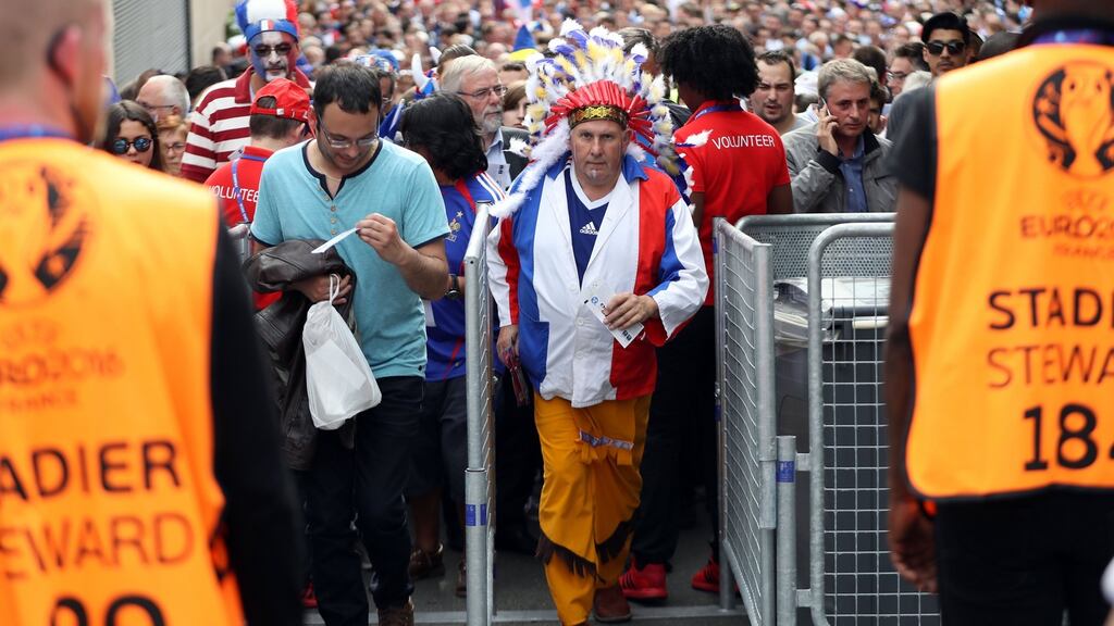 Football fans arrive several hours prior to the start of the Euro 2016 match between France and Romania at the Stade de France, in Saint-Denis, north of Paris. Photograph: Kenzo Tribouillard/AFP/Getty Images