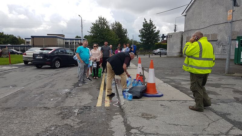 People queuing for water in at Ballsgrove shops in Drogheda Co Louth. Photograph: Paddy Logue