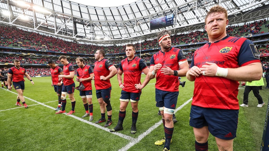 Dejected Munster players after the final whistle in the Aviva Stadium. Photograph: Billy Stickland/Ipho
