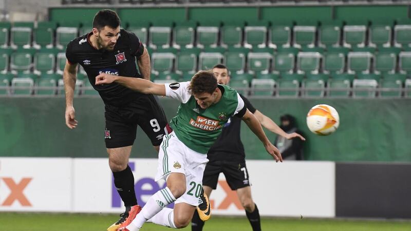 Dundalk’s Patrick Hoban beats Maximilian Hofmann of Rapid Vienna to head home the opening goal during the Uefa Europa League Group B match. Photograph: Christian Bruna/EPA