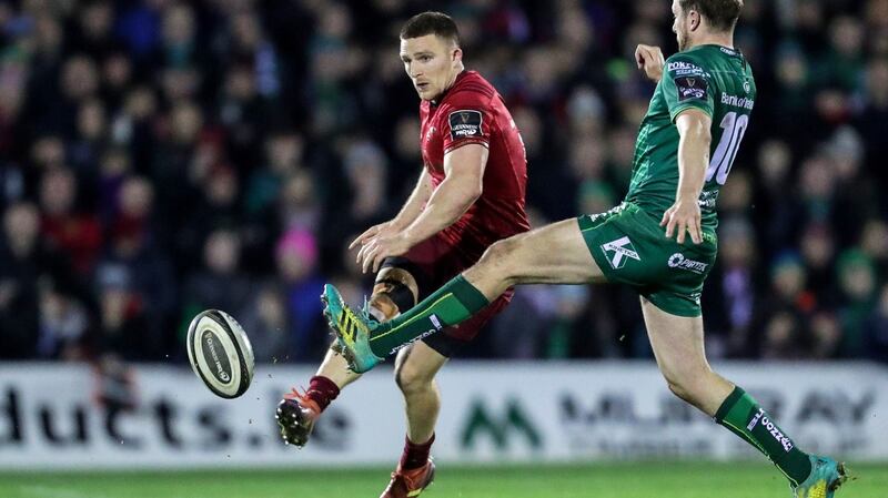 Jack Carty challenges Andrew Conway during Connacht’s defeat to Munster in Galway. Photograph: Laszlo Geczo/Inpho