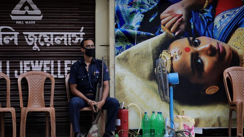 A security guard sits at a containment zone amid the coronavirus lockdown in Kolkata, India, on July 27th. Photograph: Piyal Adhikary/EPA