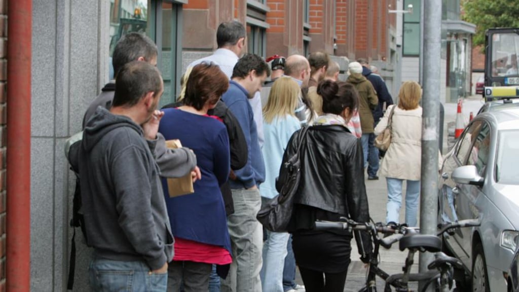 A file image of people queuing for unemployment benefit outside Bishop Street Social Welfare Office in Dublin. The Government has been told to do more by the OECD to address the issue of unemployment. Photograph: The Irish Times