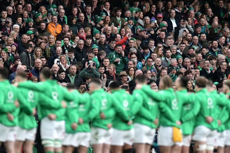 Fans of Ireland show their support as the team line up for the national anthem. Photograph: Charles McQuillan/Getty