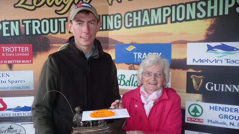 Rosemary Maguire presenting the Denis Maguire Memorial Trophy to junior winner Brendan Heaney at Melvin Open.
