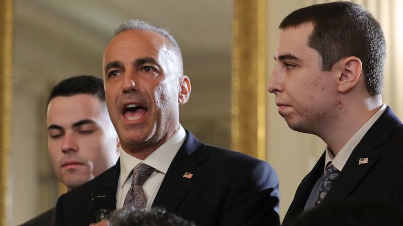 Andrew Pollack, whose daughter Meadow was killed last week at Marjory Stoneman Douglas High School, with his sons as he addresses a listening session with US president Donald Trump at the White House on Wednesday. Photograph: Chip Somodevilla/Getty Images