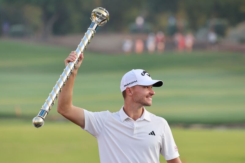 Denmark's Nicolai Hojgaard with the winner's trophy after his victory in the DP World Tour Championship European Tour at Jumeirah Golf Estates in Dubai. Photograph: Giuseppe Cacace/AFP via Getty Images