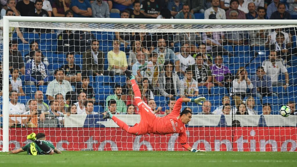 Real Betis striker Arnaldo Sanabria heads the ball home past Real Madrid goalkeeper Keylor Navas in added time at the end of the La Liga game at the Bernabeu on Wednesday night. Photograph: Gabriel Bouys/AFP/Getty Images