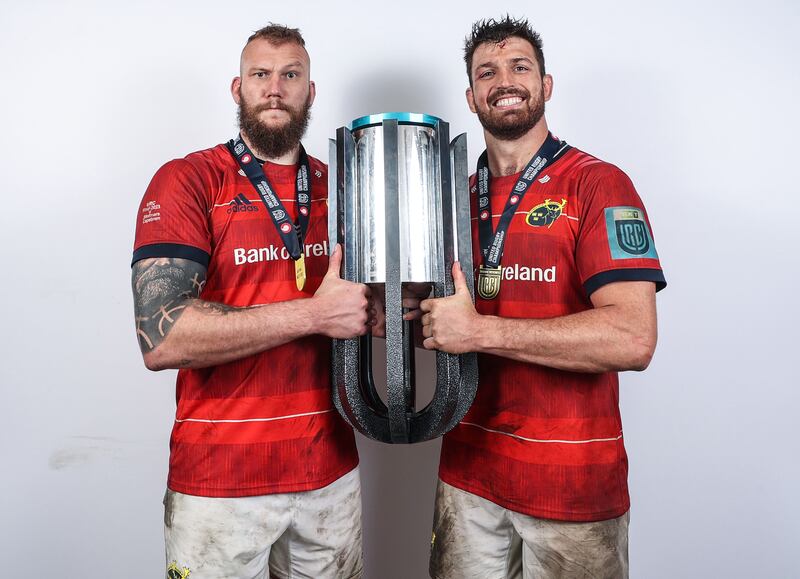 RG Snyman and Jean Kleyn celebrate Munster winning the URC Trophy. Photograph: James Crombie/Inpho