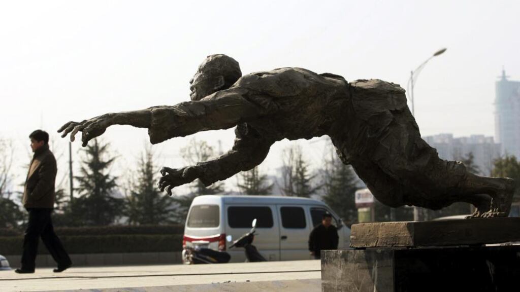 A man walks past a sculpture outside the Memorial Hall of the Victims of the Nanjing Massacre by Japanese Invaders, in Nanjing. Photograph: China Photos/Getty Images