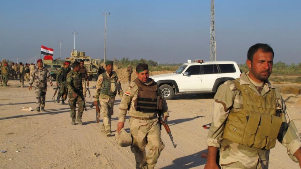 Iraqi security forces  drive insurgents out of Jurf al-Sakhar, where at least 27 Shia militiamen died in a suicide bomb attack. Photograph: Reuters
