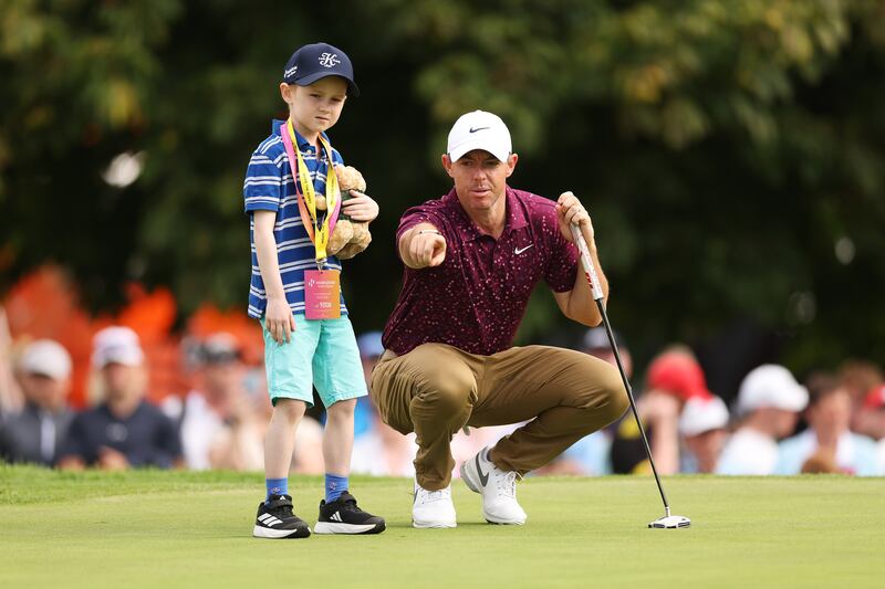 Rory McIlroy shows young Michael Horgan how it's done during the Pro-Am prior to the Horizon Irish Open at the K Club in Straffan, Ireland. Photograph: Oisin Keniry/Getty Images
