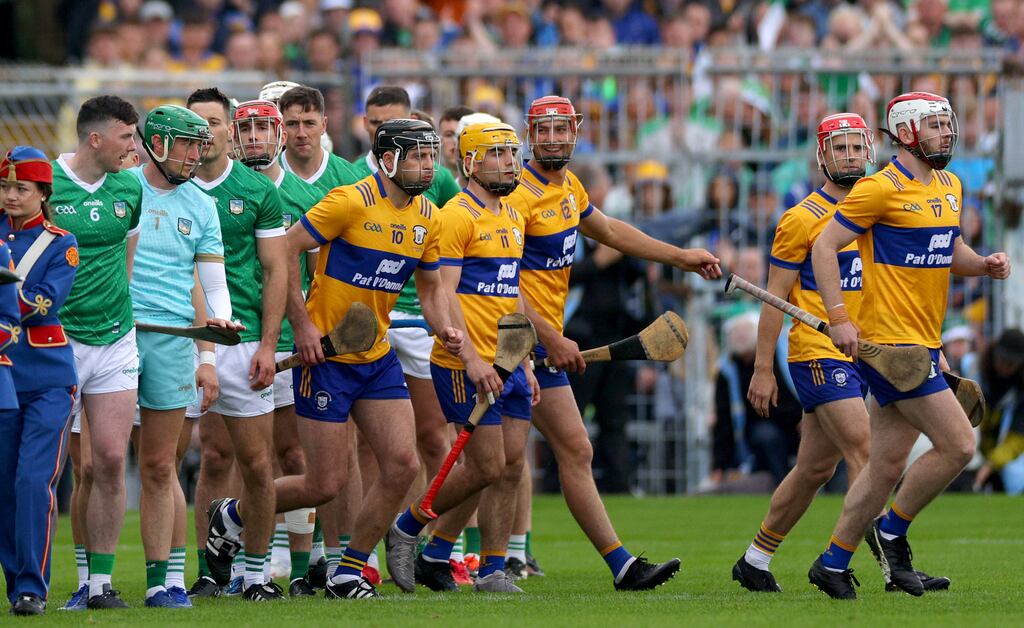The teams from Limerick and Clare teams break from the parade before the Munster SHC final in Semple Stadium on Sunday. Photograph: James Crombie/Inpho