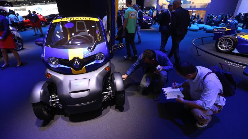 Visitors inspect a Renault ZE Twizy compact electric automobile at the Renault SA exhibition stand during the Frankfurt Motor Show in Frankfurt. Photograph: Chris Ratcliffe/Bloomberg