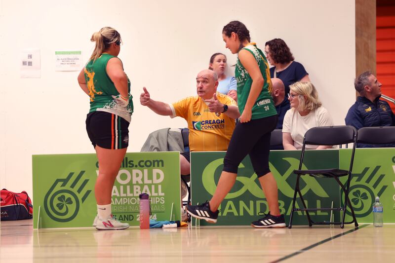 Patrick Roberts, from Glengormley, gives advice to Mairead Roberts and Kerrie McKague, Naomh Éanna