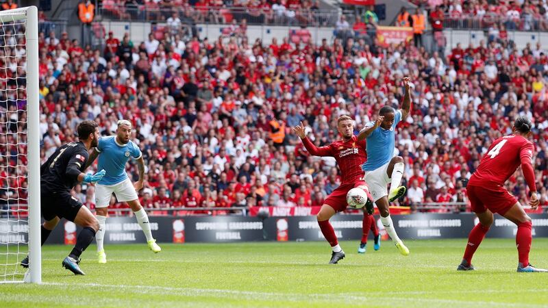 Raheem Sterling opens the scoring for Man City against Liverpool. Photograph: David Klein/Reuters