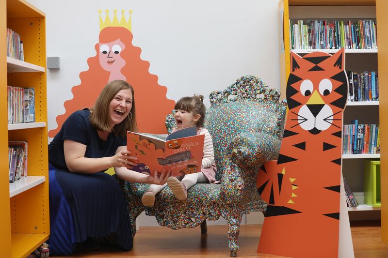 Children’s Books Ireland chief executive Elaina Ryan with young reader Kate (3) launching Picture This, a reading guide aiming to break down barriers to children’s reading. Photograph: Julien Behal