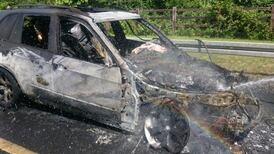 Burning car on M50 causes long traffic delays