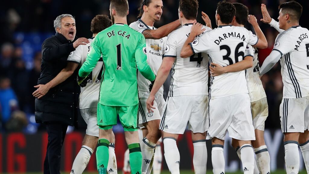 Manchester United manager Jose Mourinho and his team celebrate after their Premier League win over Crystal Palace. Photo: Stefan Wermuth/Reuters