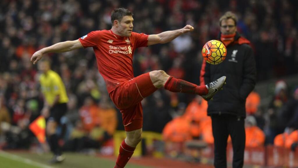 James Milner under the watchful eye of Jurgen Klopp. The midfielder has played in a number of different roles since arriving at Anfield. Photograph: Paul Ellis/AFP