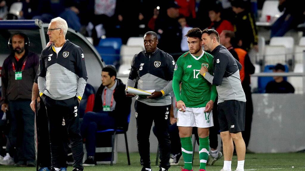 Ireland’s Aaron Connolly with assistant manager Robbie Keane before he comes on during the Euro 2020 qualifier against Georgia in Tbilisi. Photo: Ryan Byrne/Inpho