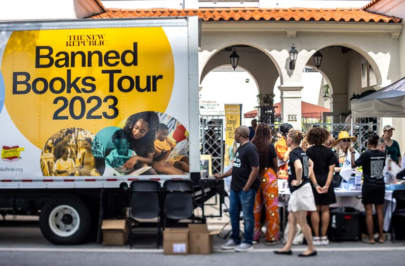 People attend the 'Banned Book Mobile Tour' event in Coral Gables, Florida, last October. The 'banned bookmobile' carries more than 1,000 free books and offers literacy tips, tools and professional development resources on how Floridians can take action to keep books widely accessible for parents, students and educators. Photograph: Cristobal Herrera-Ulashkevich/EPA