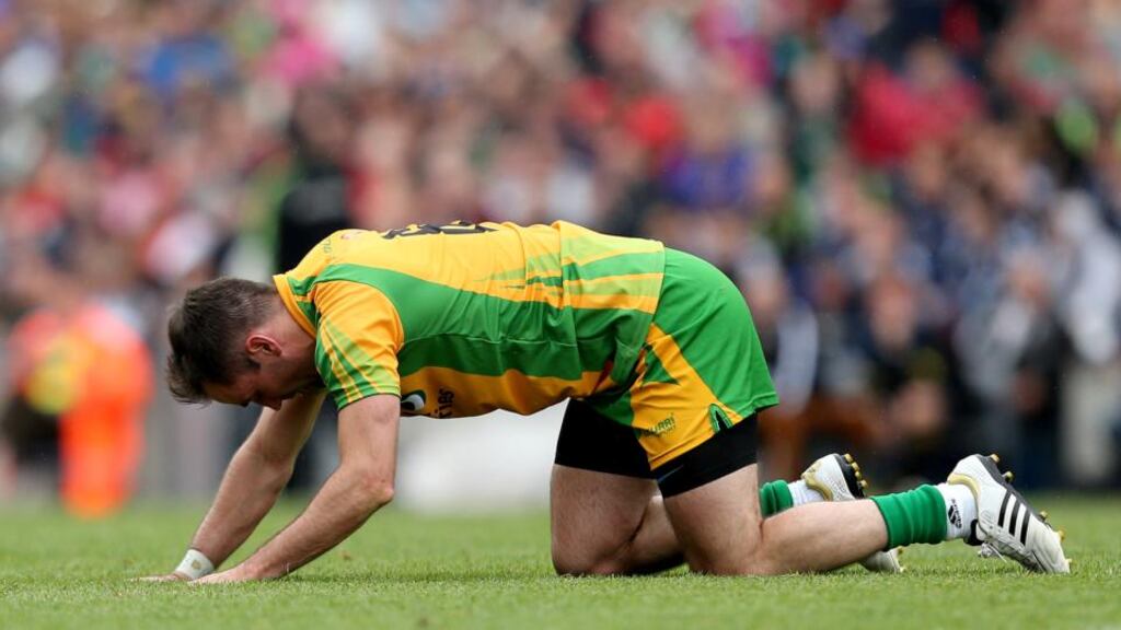 Donegal’s Karl Lacey looks dejected after his side’s All-Ireland quarter-final loss to Mayo. Photograph: James Crombie/Inpho
