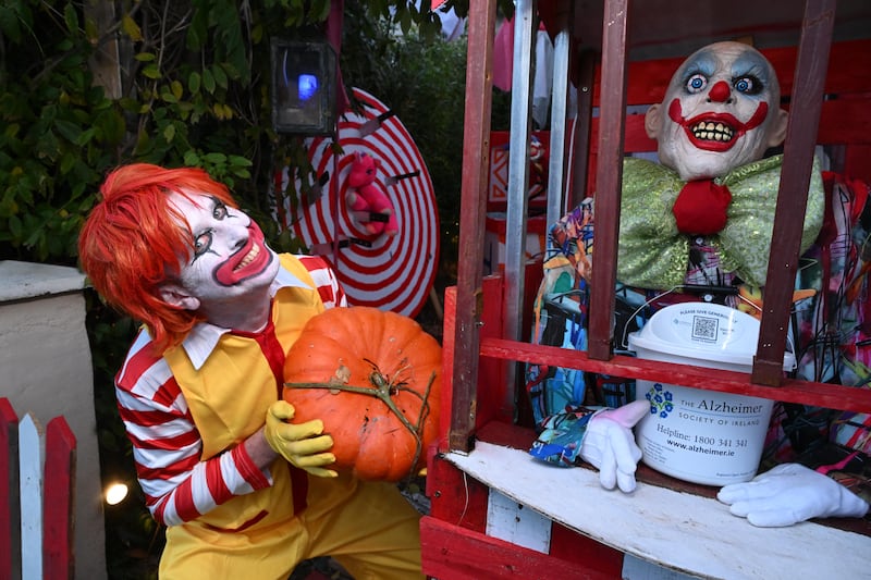 The home of Diego Gonzalez and Harry Weir on Stannaway Road is barely visible behind a horror circus of lifesize clownish figures. Photograph: Bryan Meade