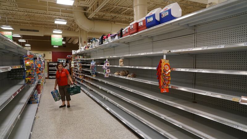 Customers browse empty shelves at a Publix Super Markets store ahead of Hurricane Matthew making landfall in West Palm Beach, Florida on Wednesday. Photograph: Mark Elias/Bloomberg